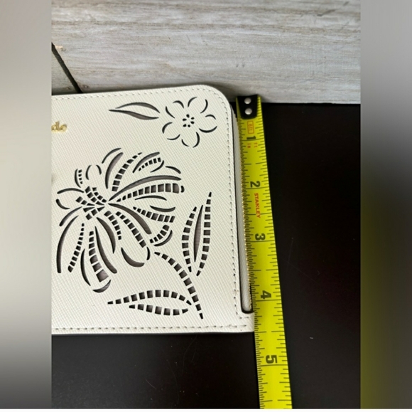 Kate Spade Cream Wristlet with Floral Cutouts - Picture 6 of 8